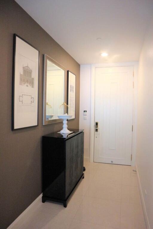 Modern hallway with white walls and decorative artwork