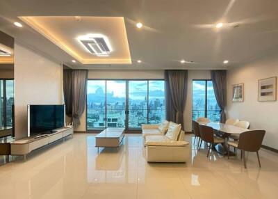 Modern living room with dining area and city view