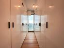 Hallway with storage closets and large windows