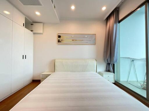 Modern bedroom with white furnishings