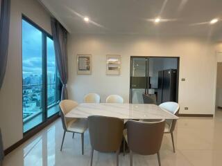 Modern dining area with large windows and city view