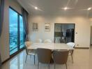 Modern dining area with large windows and city view