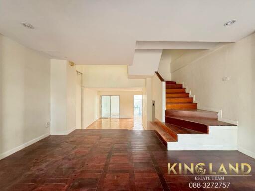 Spacious living room with wooden flooring