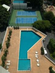 Outdoor area with swimming pool and tennis courts