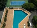 Outdoor area with swimming pool and tennis courts