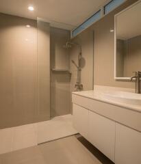 Modern bathroom with walk-in shower and vanity