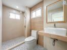 Modern bathroom with shower area and wooden accents