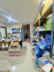 Room filled with shelves, boxes, and various supplies