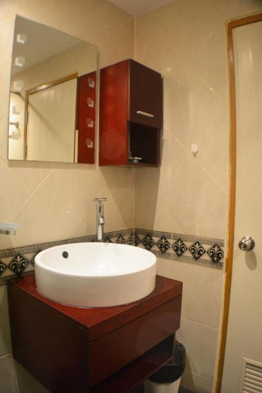 Bathroom with vanity sink and mirror