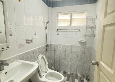 A clean and well-lit bathroom with modern fixtures