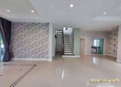 Spacious modern living room with staircase