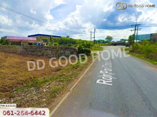 Street view with a gas station in the background