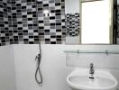 Modern bathroom with white and black tiles