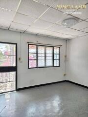 Empty living room with large window and door