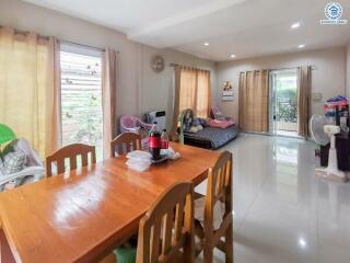 Spacious living area with dining table and lounging space