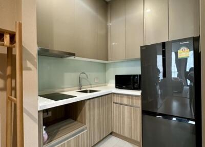 Modern kitchen with sleek cabinetry and appliances