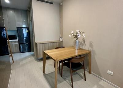 Cozy dining area with a wooden table and two chairs