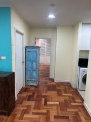 Interior hallway with wooden floors and furniture