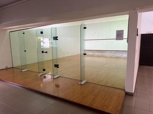 Indoor squash court with glass walls