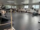 Spacious gym with various exercise equipment