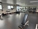 Well-equipped gym with exercise machines and weights