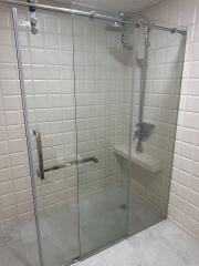 Modern glass shower enclosure with rain shower head