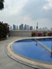 Rooftop swimming pool with city skyline view