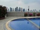 Rooftop swimming pool with city skyline view