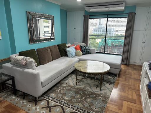 Spacious and stylish living room with a large sectional sofa and modern decor