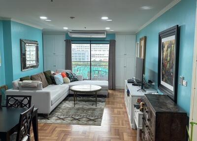 Spacious and well-lit living room with a view