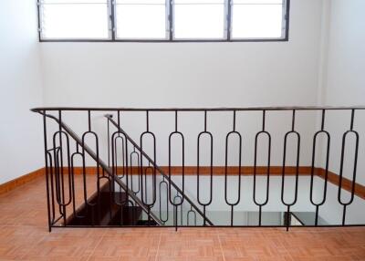 Modern staircase with iron railing