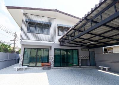 Two-story house with a carport