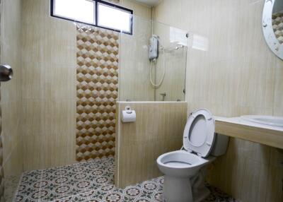 Modern bathroom with decorative tiles and sanitary ware