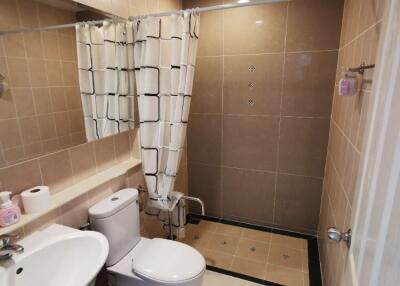 Modern bathroom with large shower area and stylish fixtures