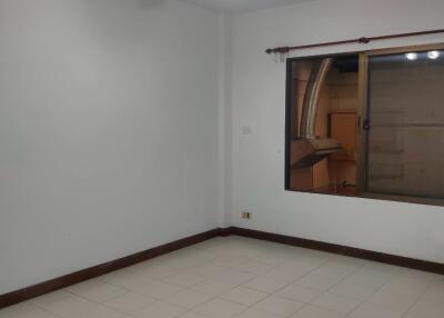 Empty bedroom with ceiling fan and window