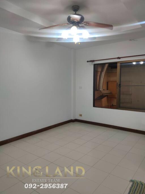 Empty bedroom with ceiling fan and window