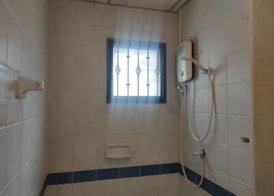 Bathroom with shower and window