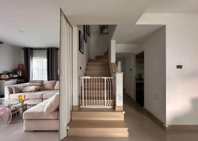 Modern living room with stairs and baby gate