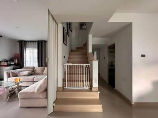 Modern living room with stairs and baby gate