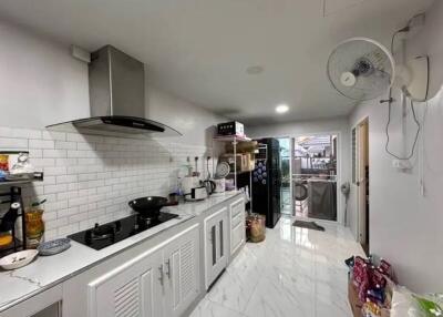 Modern kitchen with appliances and white cabinets