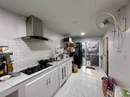 Modern kitchen with appliances and white cabinets