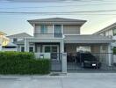 Exterior view of a modern house with a carport