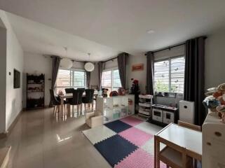 Spacious living room with dining area and play corner