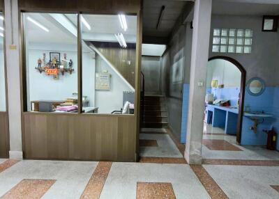 Interior hallway with office and stairwell