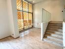 Modern living room with wooden flooring and staircase