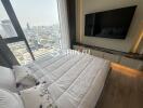 Modern bedroom with large window and city view