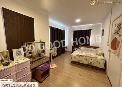 Bedroom with wooden flooring and modern decor