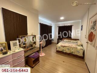 Bedroom with wooden flooring and modern decor