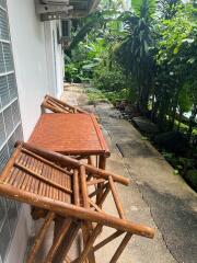 Outdoor seating area next to a garden