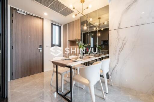 Contemporary dining area with modern furnishings and elegant lighting